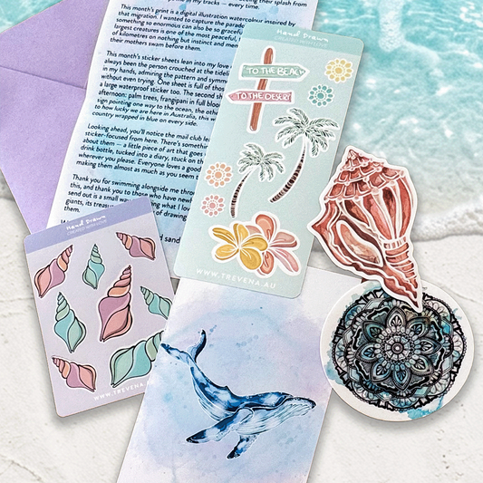 A styled flat-lay of beach-themed stationery items on white sand with seashells and turquoise water in the background. The set includes a purple envelope, a printed poem card, a sticker sheet with colorful seashell and floral designs, a blue whale illustration card, a directional sign sticker, and a circular mandala sticker.