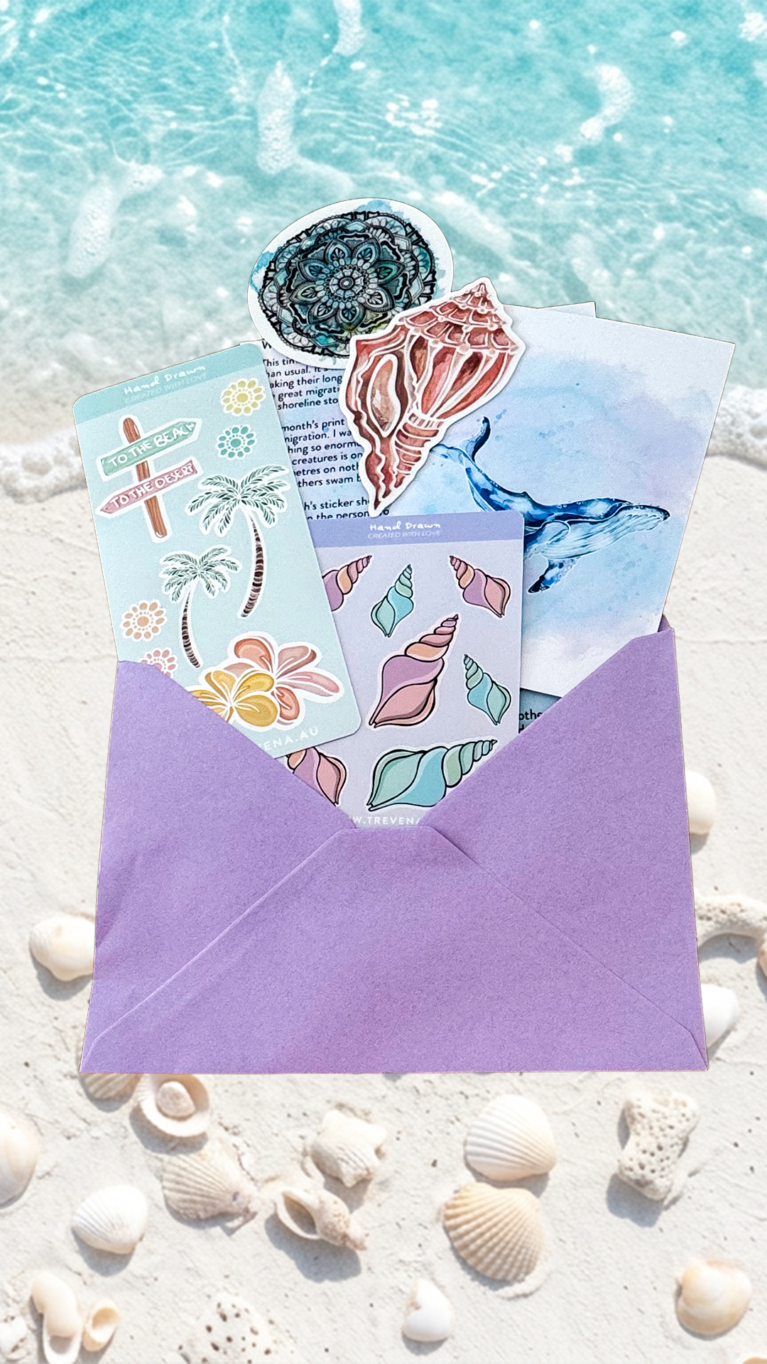 A purple envelope filled with colorful tropical and mermaid-themed sticker sheets, placed on white sand with seashells and turquoise ocean water in the background.